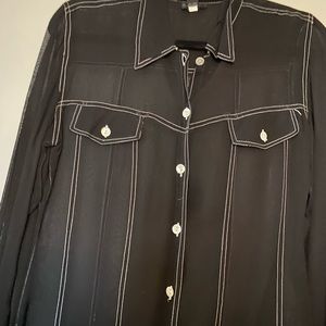 Sheer black button down shirt. Cute for going out.